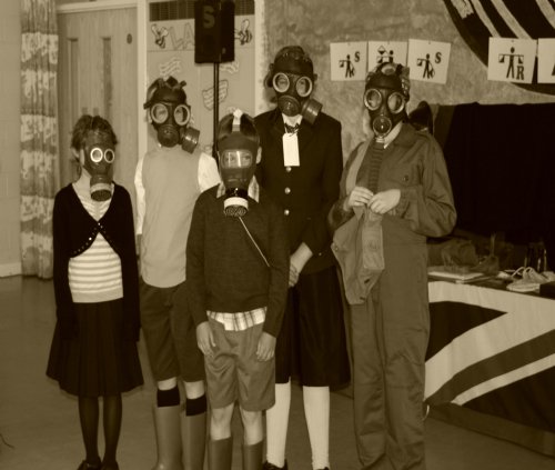 Trying on gas masks